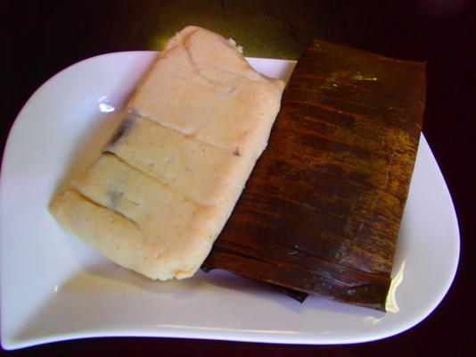 Tamales van het varkensvlees in bananenbladeren (tamales con puerco)