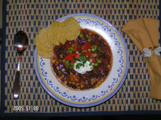 varkensvlees, zwarte bonen en maïs chili